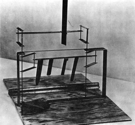 Reproduction of lift balance used in 1901 wind tunnel; model airfoil in testing position. Source: NPS.